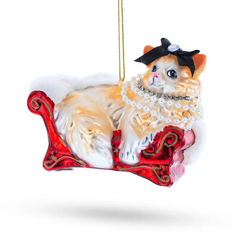 Cat in Pearl Necklace Lounging on Luxurious Sofa Blown Glass Christmas Ornament